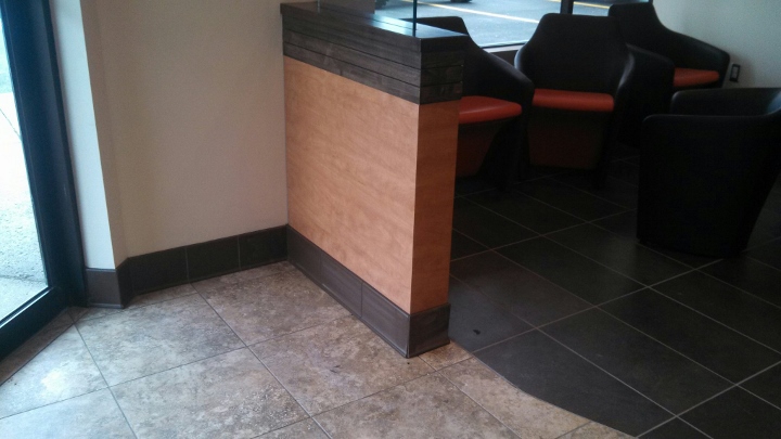 This image depicts a custom tile installation at Dunkin' Donuts. This tile flooring project was completed by Youngstown Tile & Terrazzo.