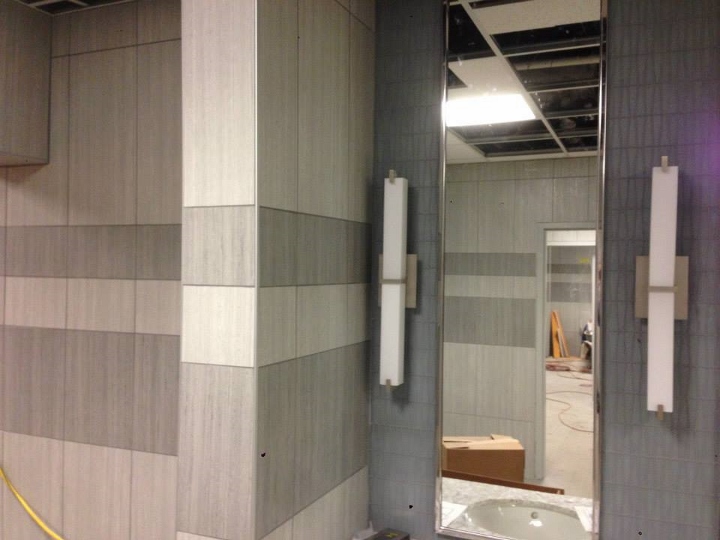 This image depicts a commercial tile installation at a pool and locker room. This project was completed by Youngstown Tile & Terrazzo.